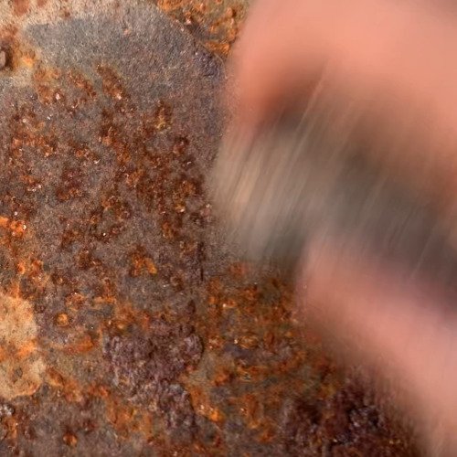 Rusted iron sheild cleaning