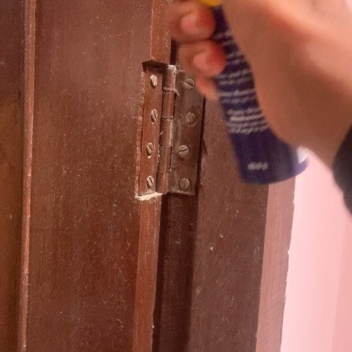 Clean the door iron parts by spray