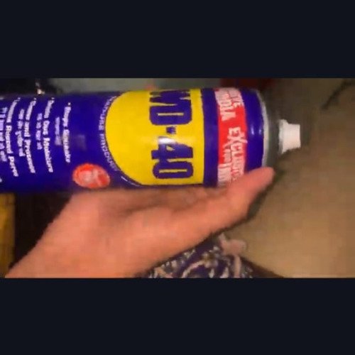 WD-40 Multi-Use Product. This product is being used to clean a brass rod.